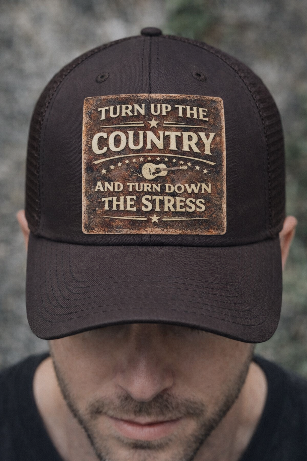 Black cap Country Music DTF Transfer – Turn Up The Country Turn Down The Stress worn by model against a grey background.