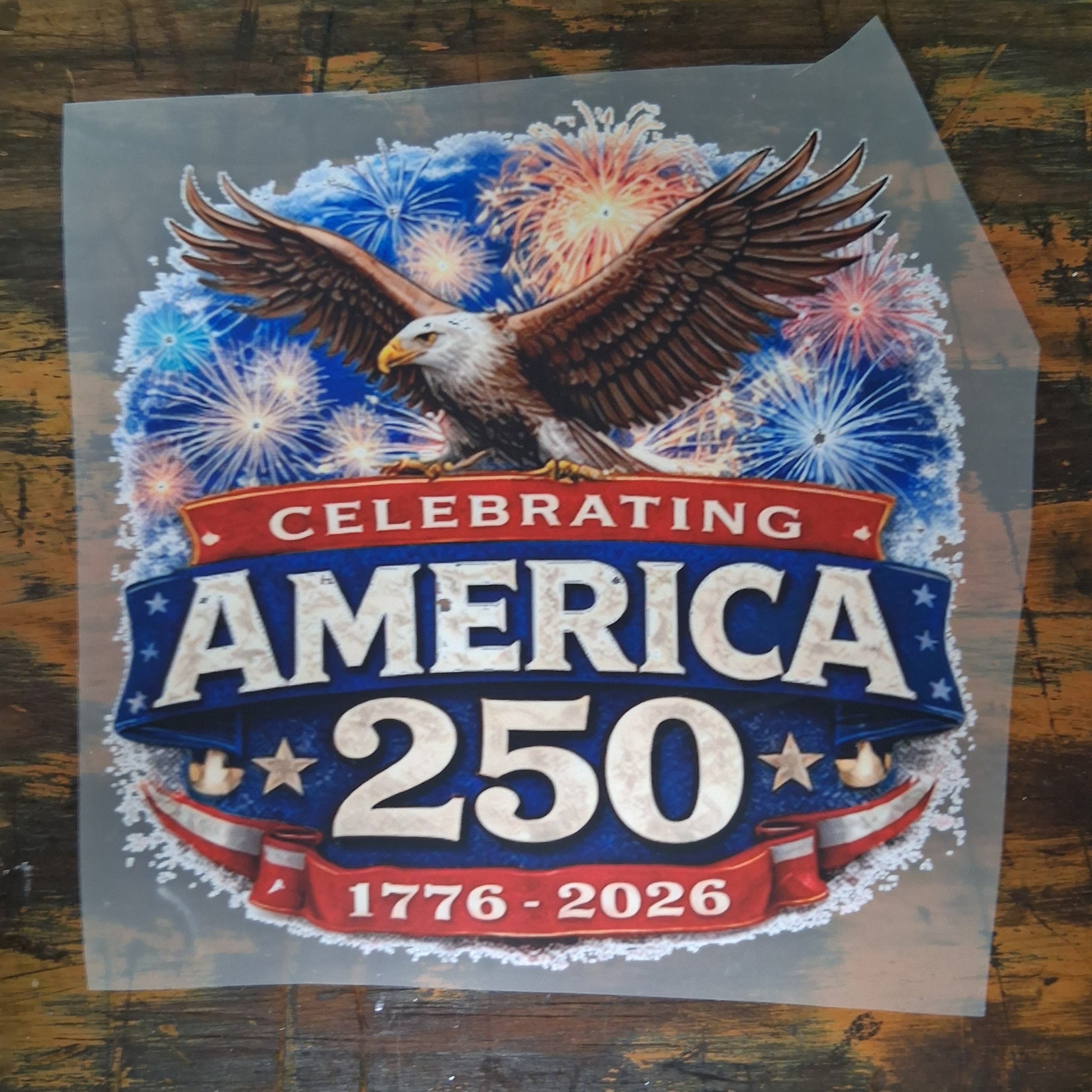 America 250 DTF Transfer Bundle - America 250 Fireworks Eagle DTF Transfer on a dark wooden background
