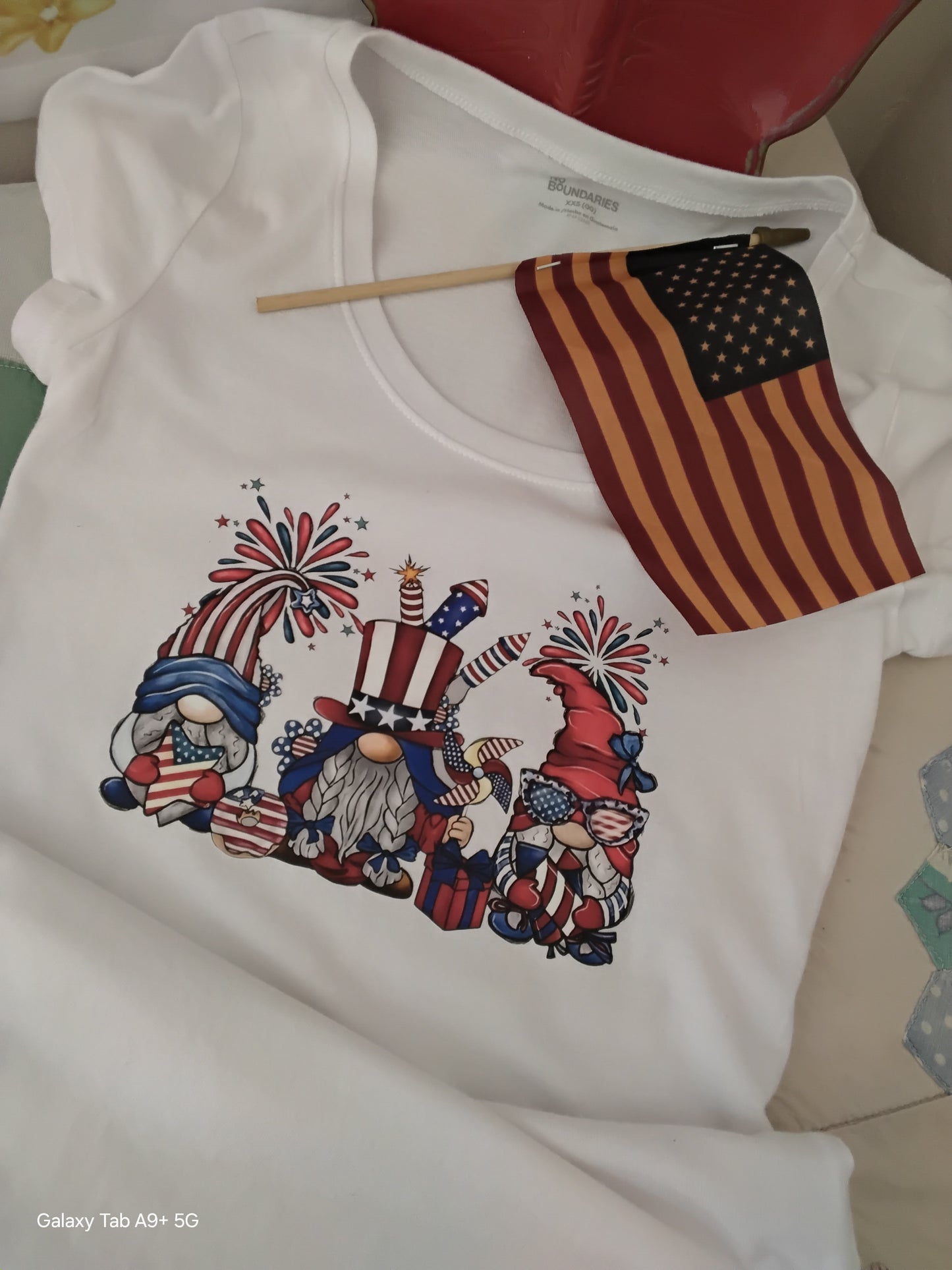 Patriotic Gnome DTF Heat Transfer Tee – 4th of July Graphic Shirt on a chair.