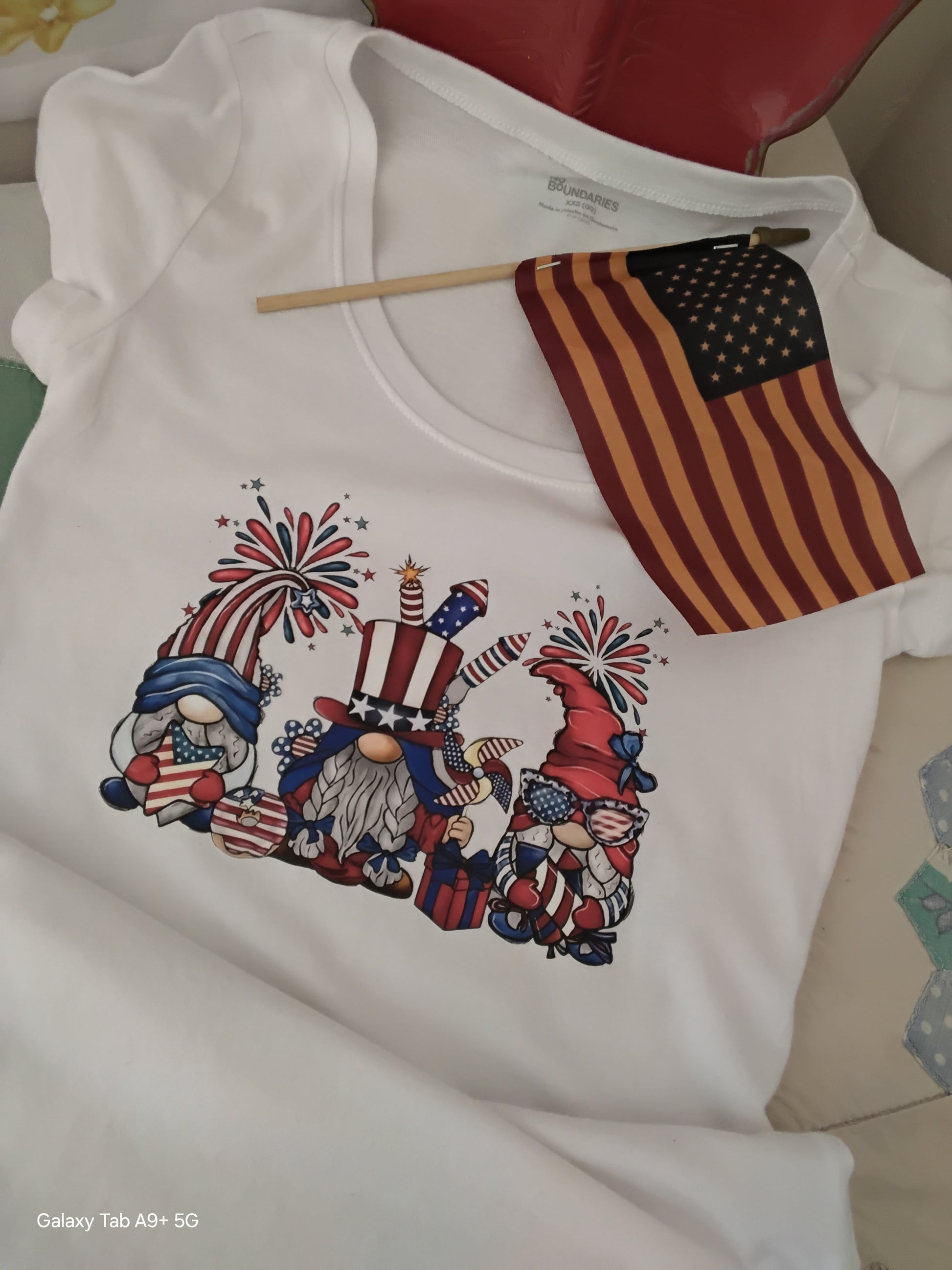 Patriotic Gnome DTF Heat Transfer Tee – 4th of July Graphic Shirt on a chair.