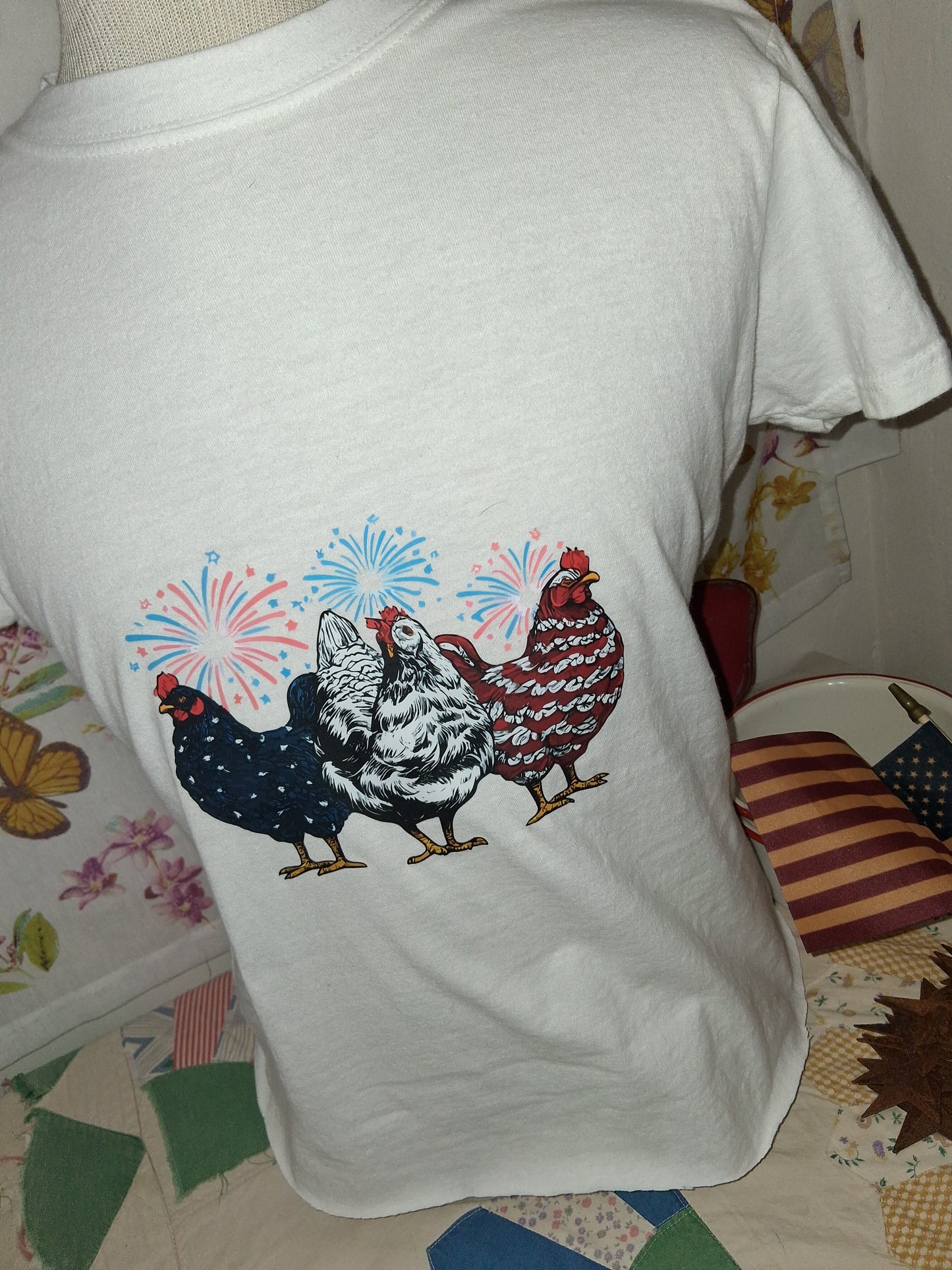 Patriotic Chicken Shirt | Farmhouse Americana Tee | Raw Hem Crop Top Large on a floral quilt