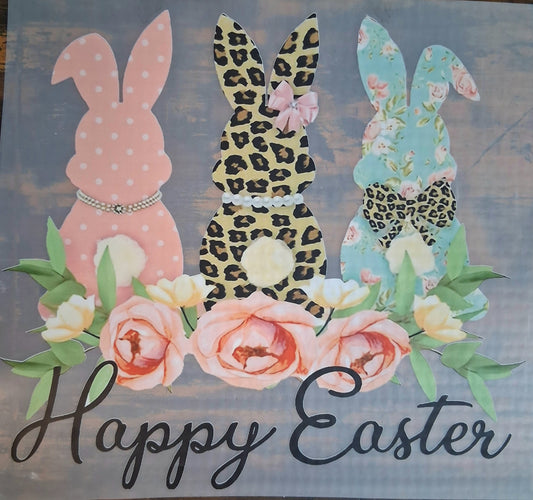 3 Bunnies Happy Easter DTF Heat Transfer on a Dark Wooden background