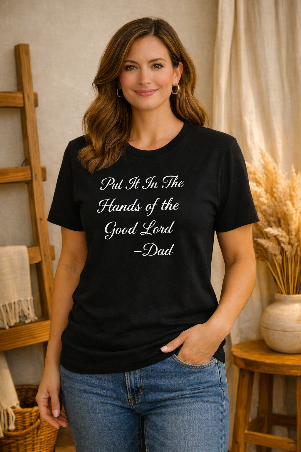 Woman wearing Hands of the Good Lord Tee, standing in a home setting.