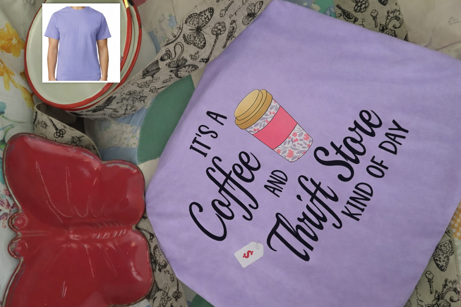 It’s a Coffee and Thrift Store Kind of Day Tee in Violet on a background decorated with a butterfly tray, ribbon and old pans