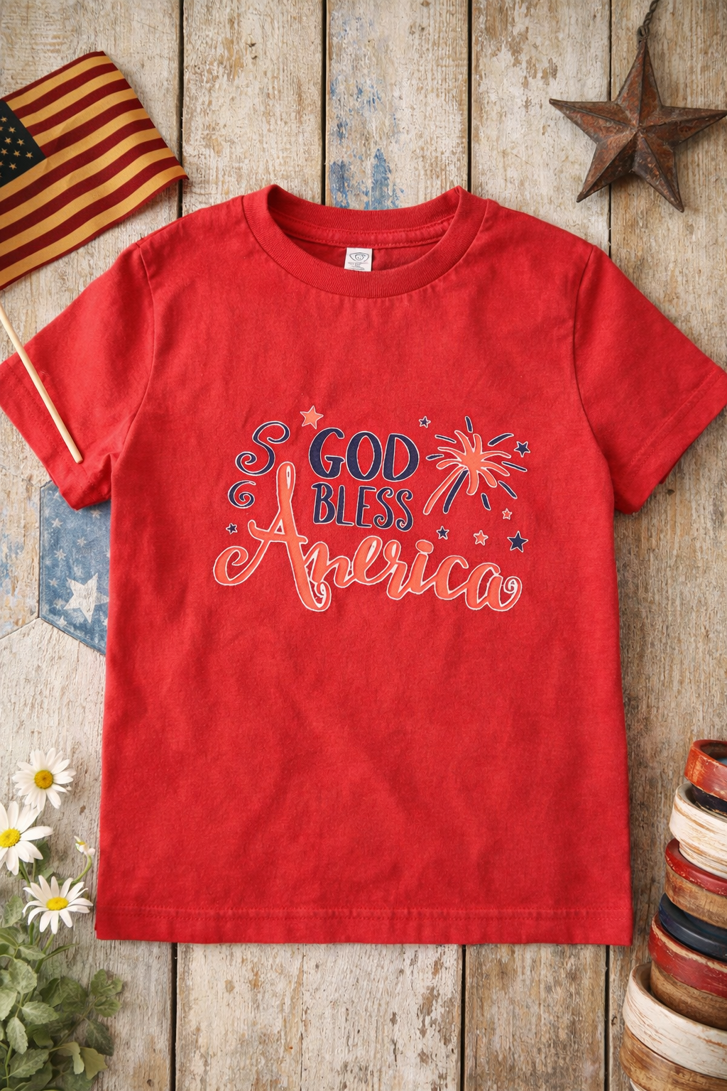 Red God Bless America Toddler Tee – Patriotic 4th of July Shirt on a wooden background