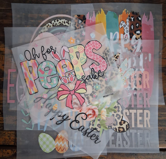 Easter Bundle - Medium - Colorful Easter-themed DTF Heat Transfers with text and graphics on a wooden surface