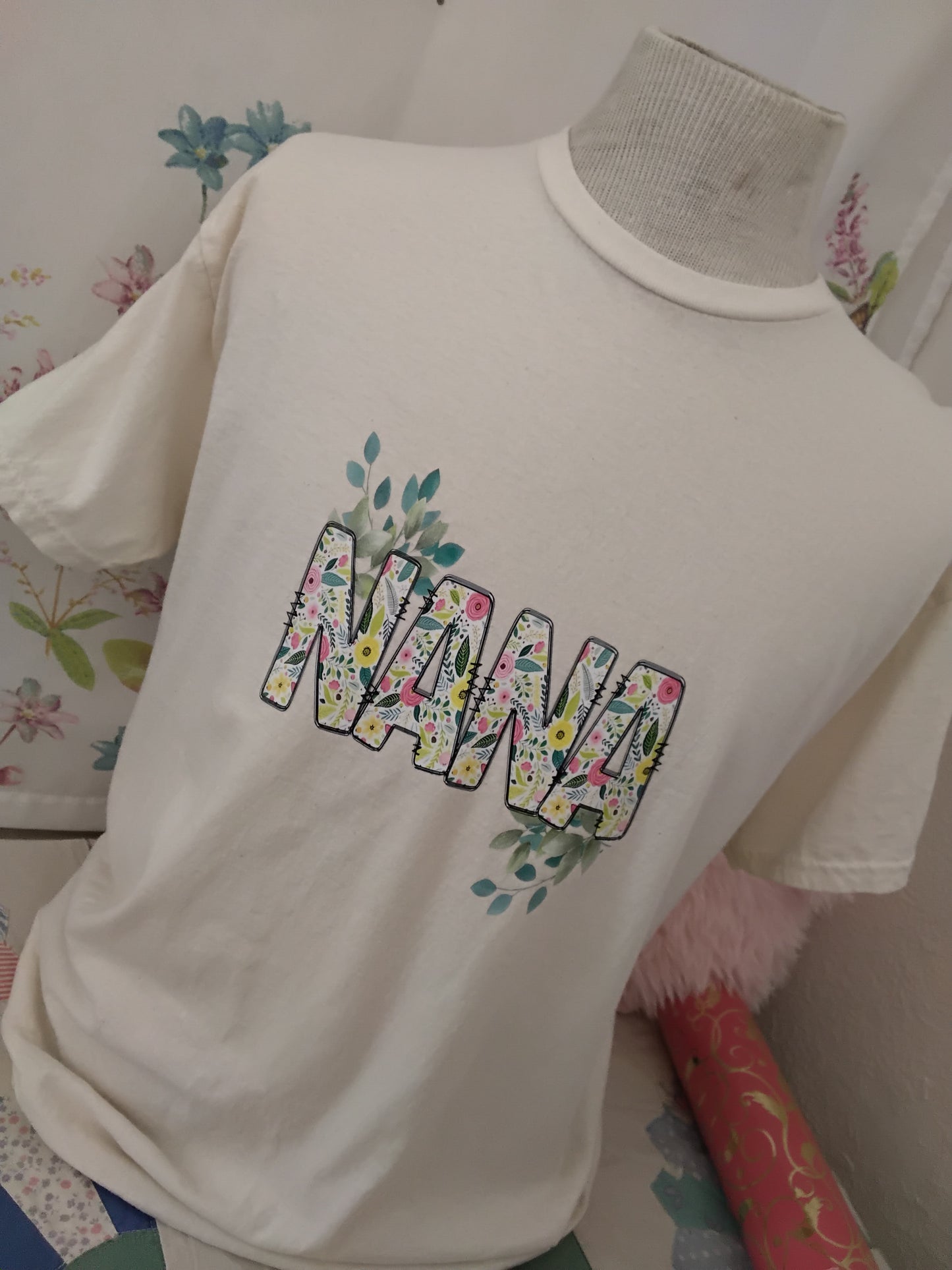 Nana Floral Tee in Natural on a floral fabric background